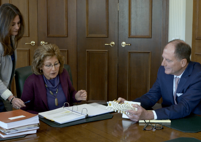 Christopher Larmoyeux with a client at the conference room.